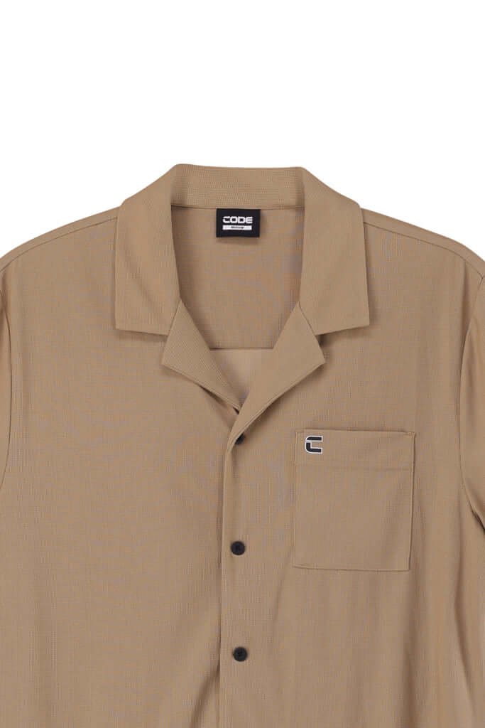 WAFFLE KNIT SHIRT in a light brown color with button closure and subtle branded trims, perfect for everyday comfort.