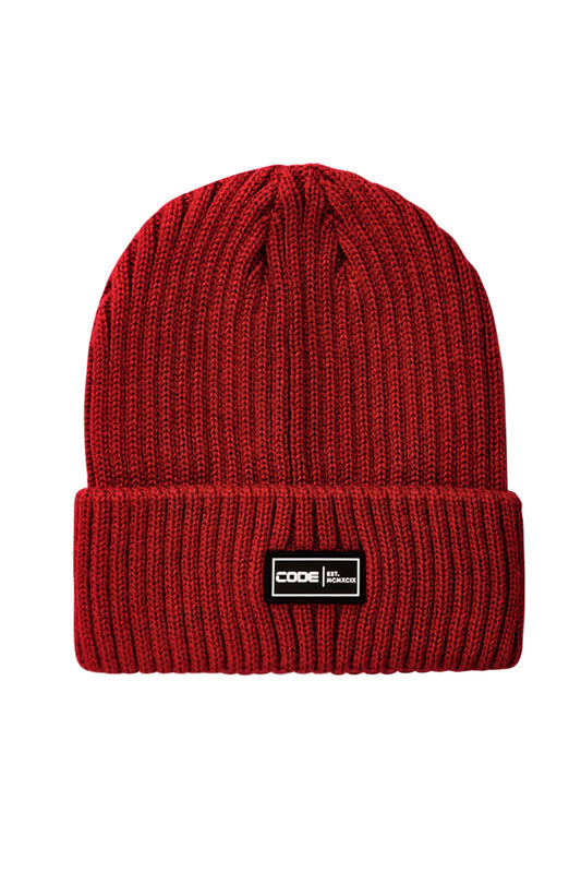 Front view: A rich sundried tomato-colored beanie, adding warmth and a touch of bold color to your look.