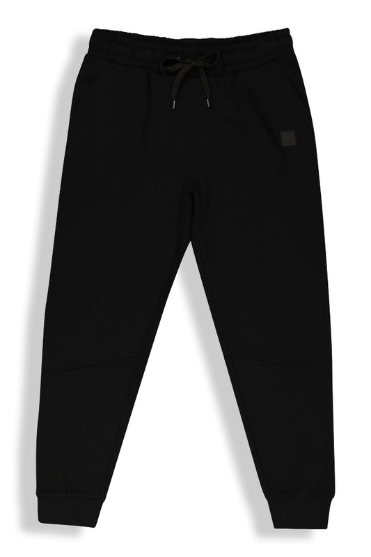 Front view of classic black joggers with a comfortable elastic waistband and drawstring for an adjustable fit.